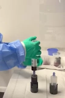 Person preparing medical samples in lab